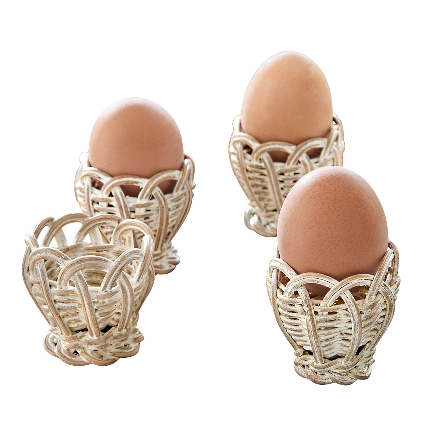 Eierbecher 4er Set Minouvelle Set weisse Rattan-Eierhalter mit braunen Natur-Eiern für ein rustikales Frühstück