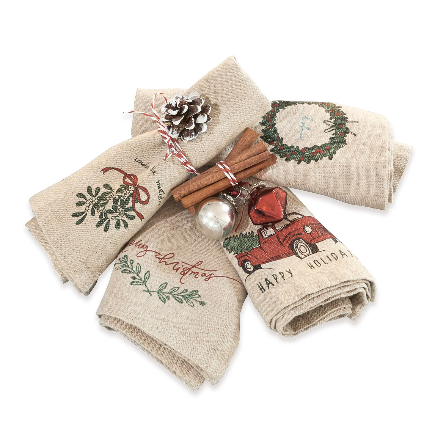 Leinen-Geschirrtücher mit Weihnachtsmotiven in Rot und Grün, dekorative Zimtstangen und Kugeln