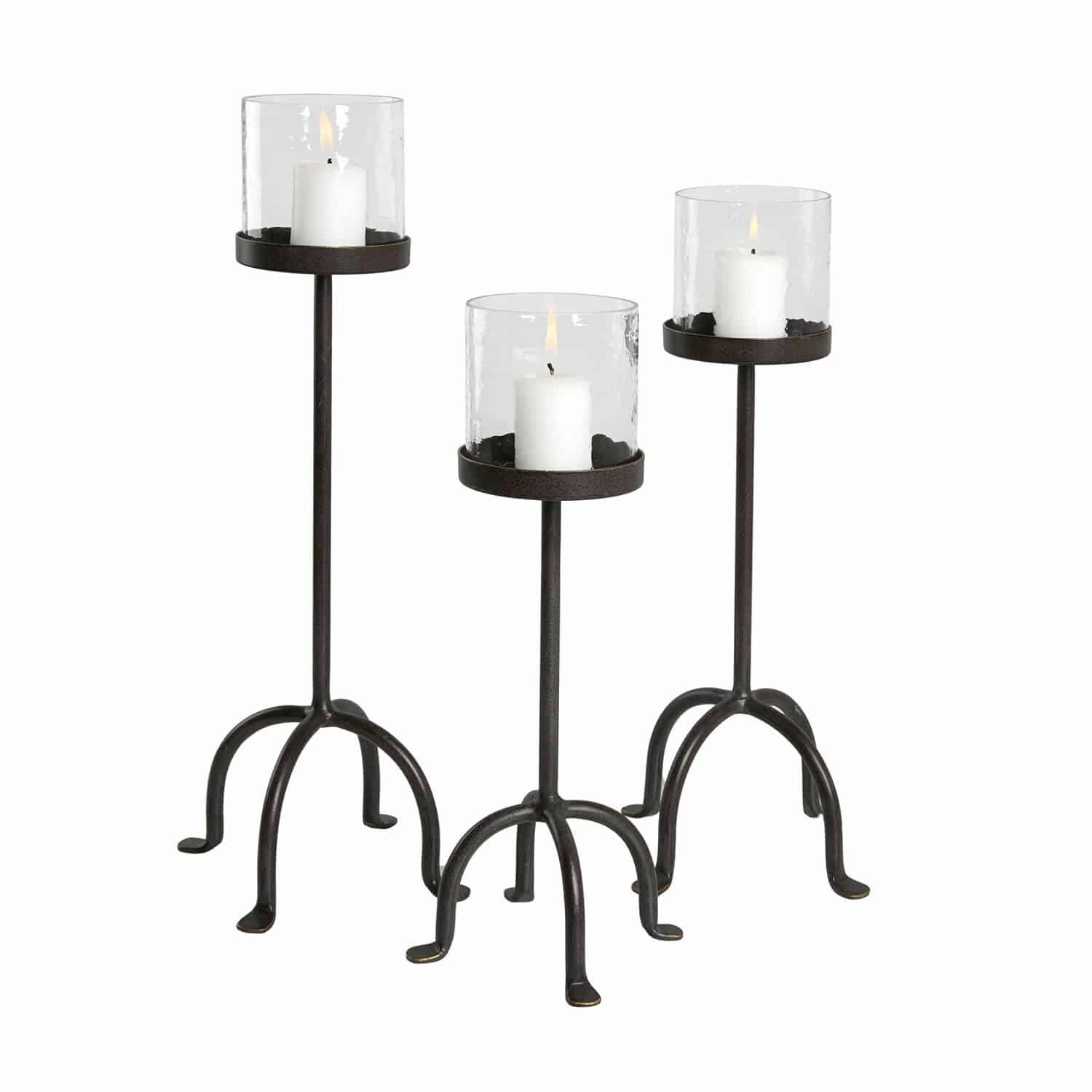 Kerzenständer 3er Set Tanbira Dreiteiliges Set aus Metallkerzenhaltern mit klarem Glas und weissen Kerzen für Wohnraumdekoration