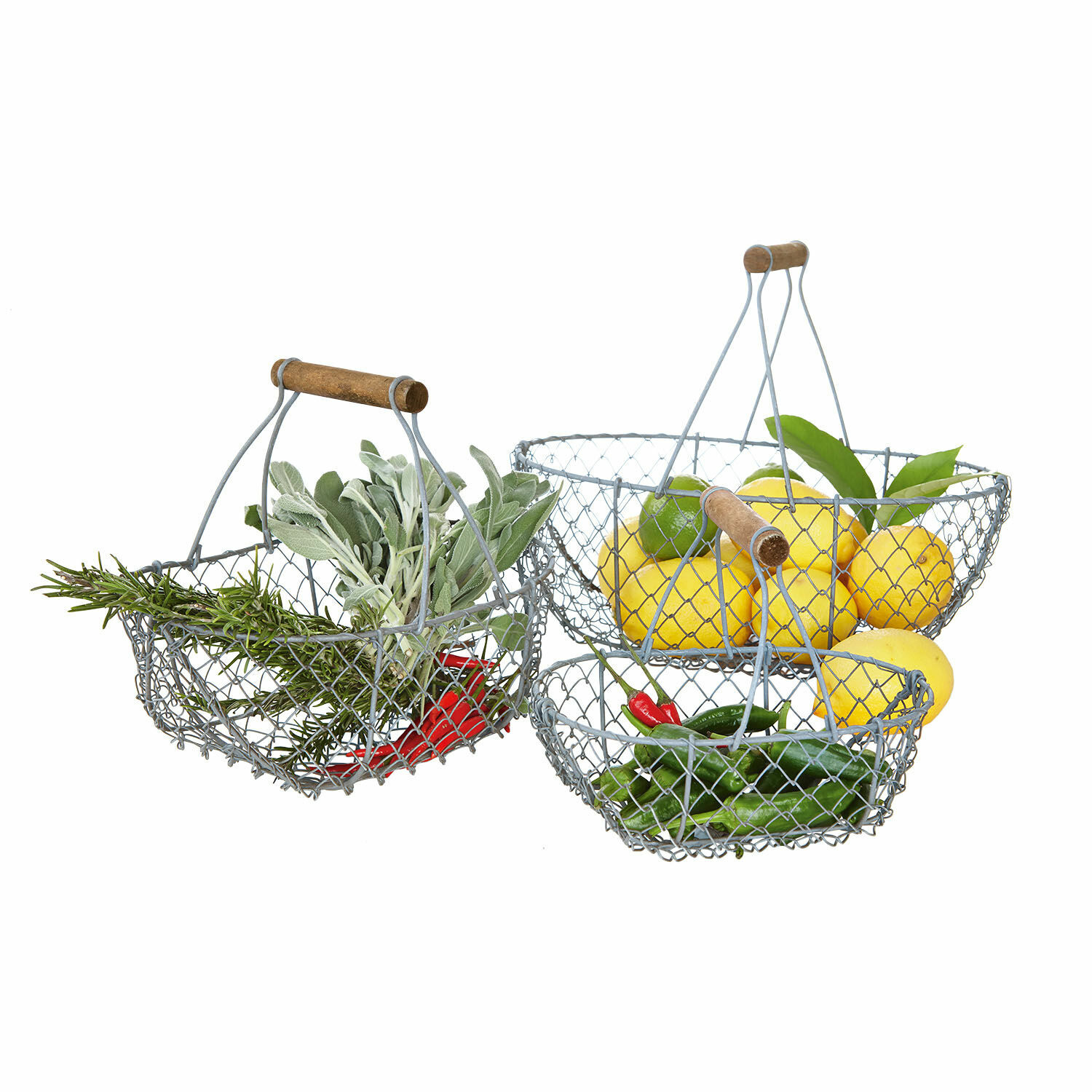 Drahtkorb 3er Set Baker Drei Drahtkörbe mit Holzgriffen, gefüllt mit Zitronen, Chili und frischen Kräutern