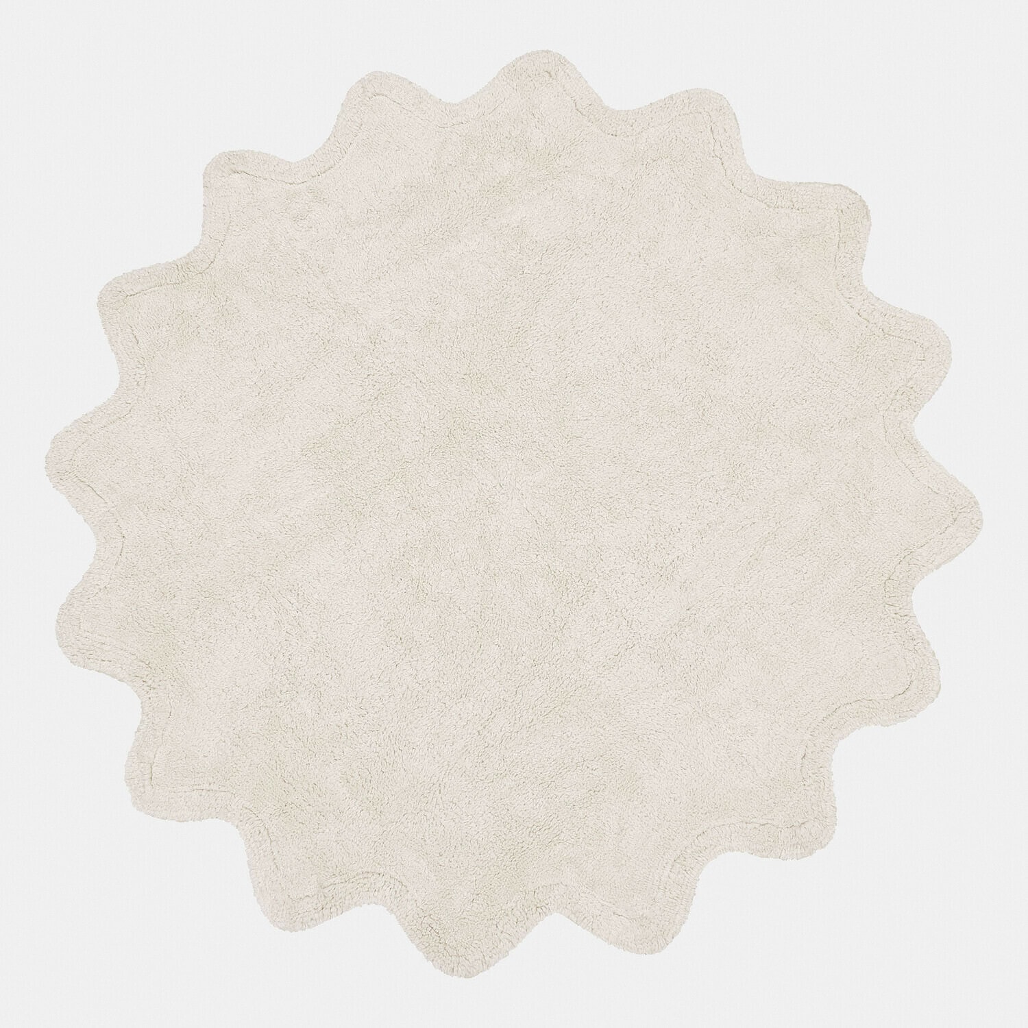 Runder cremefarbener Badteppich aus weichem Material mit wellenförmigem Rand