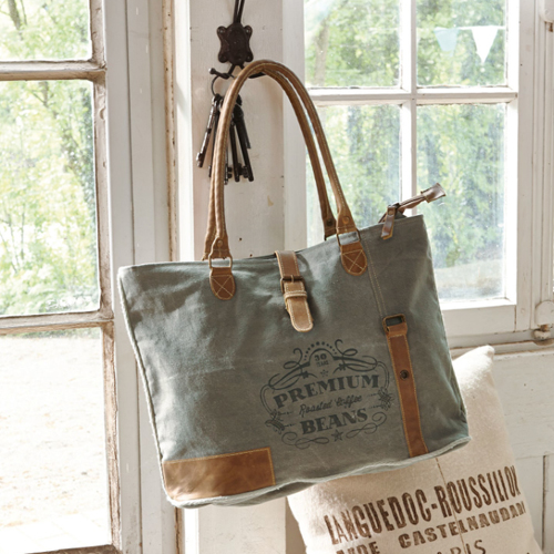 Graue Stofftasche mit braunen Ledergriffen und Aufdruck mit Premium-Kaffeebohnen