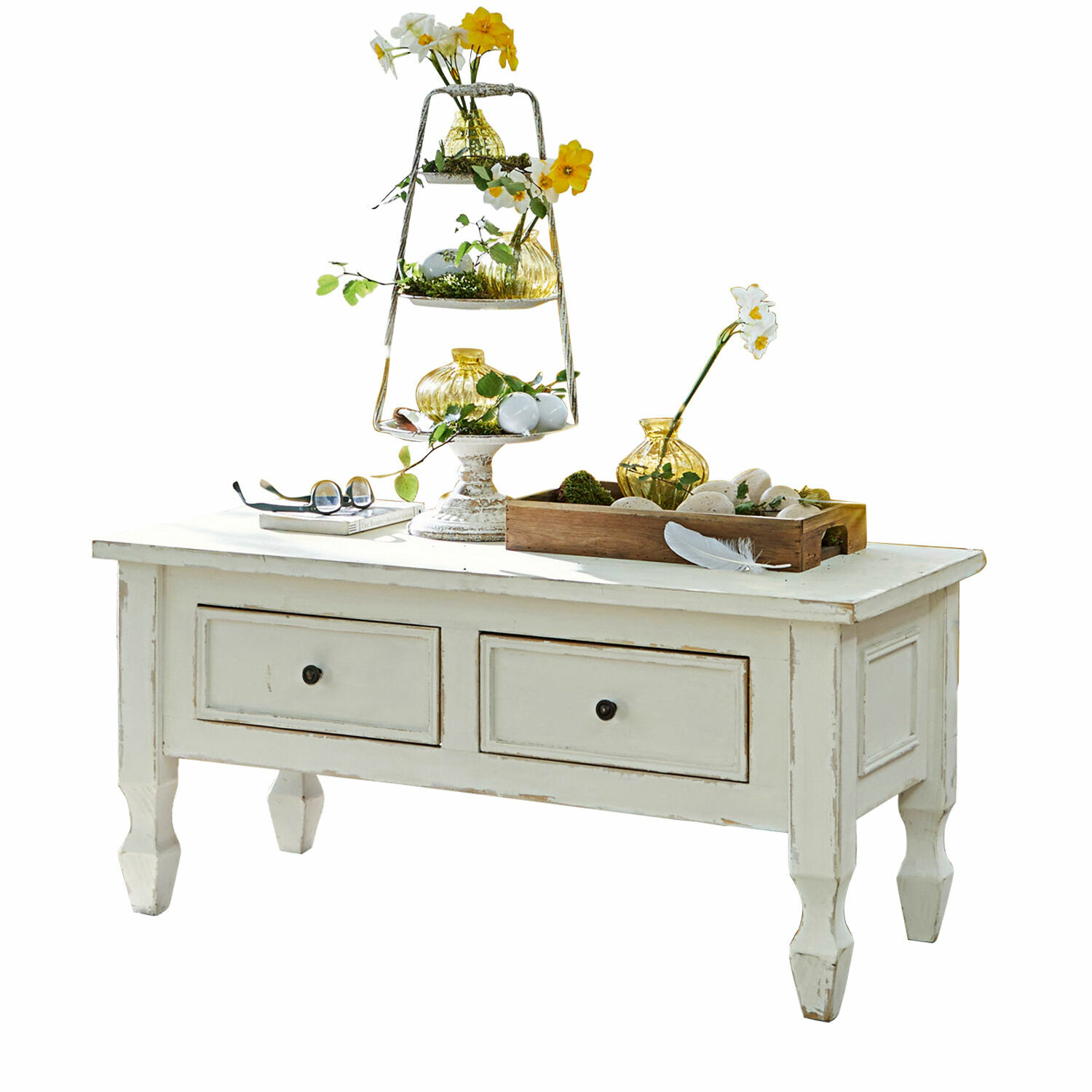 Couchtisch Yurielka Weisser Holztisch mit Schubladen und Frühlingsdekoration aus gelben Blumen und Glasvasen