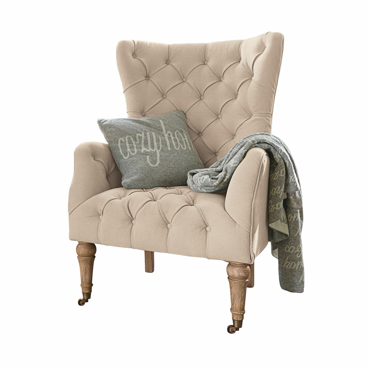 Sessel Migré Beiger, gepolsterter Sessel mit Holzfüssen, grauem Kissen und Decke cosy home