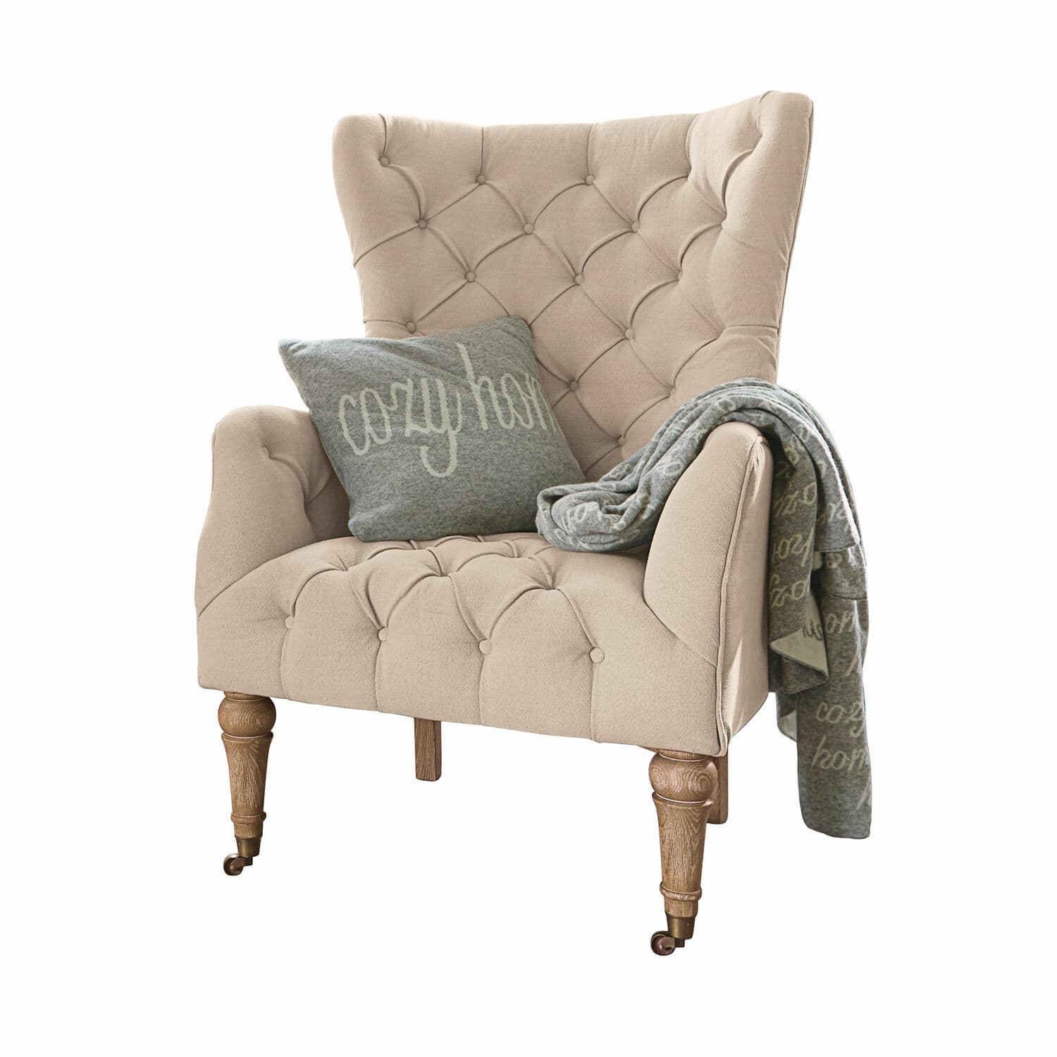 Sessel Migré Beiger, gepolsterter Sessel mit Holzfüssen, grauem Kissen und Decke cosy home
