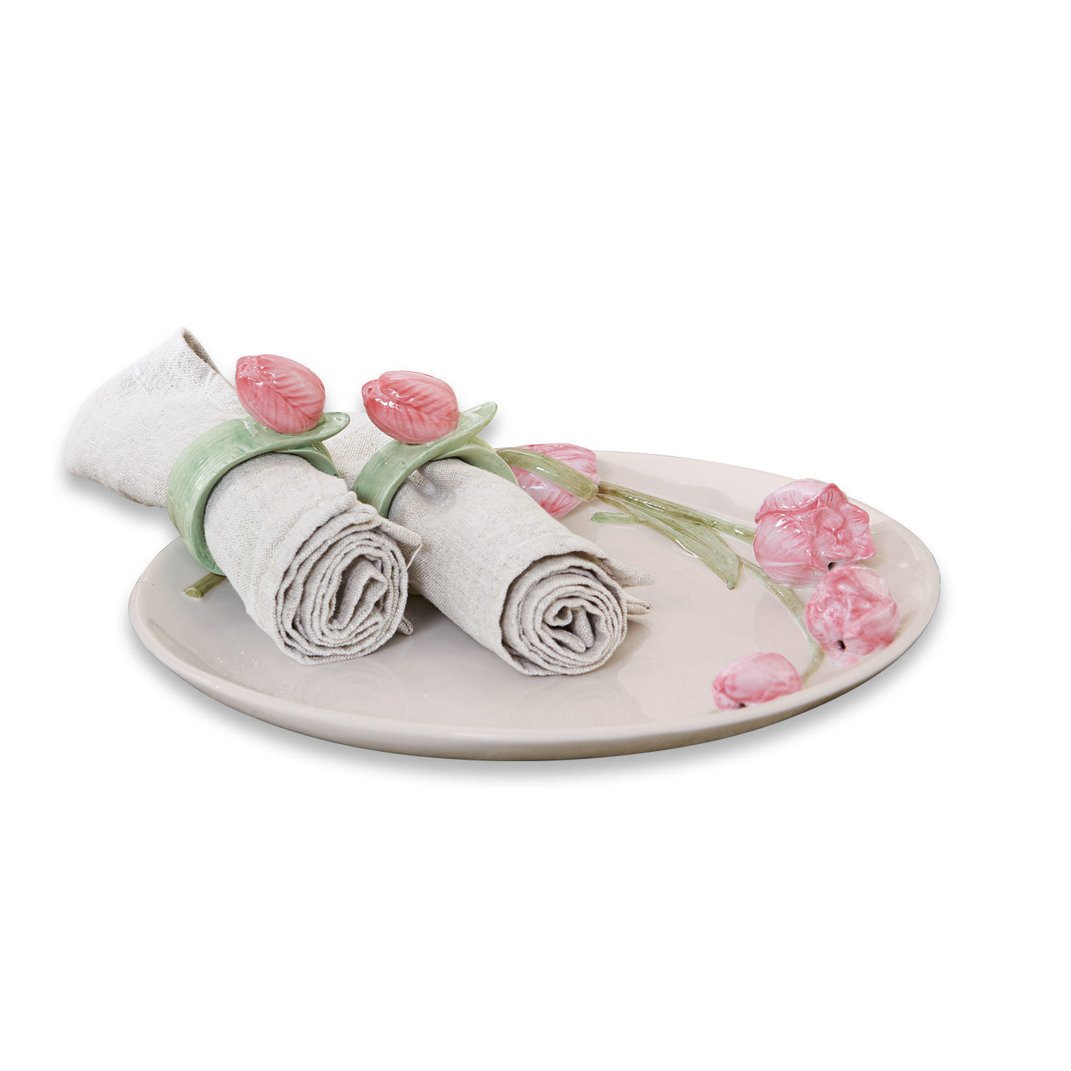 Platte Monique Keramikteller mit rosa Blumen und Leinenservietten mit grünen Ringen als Tischdekoration