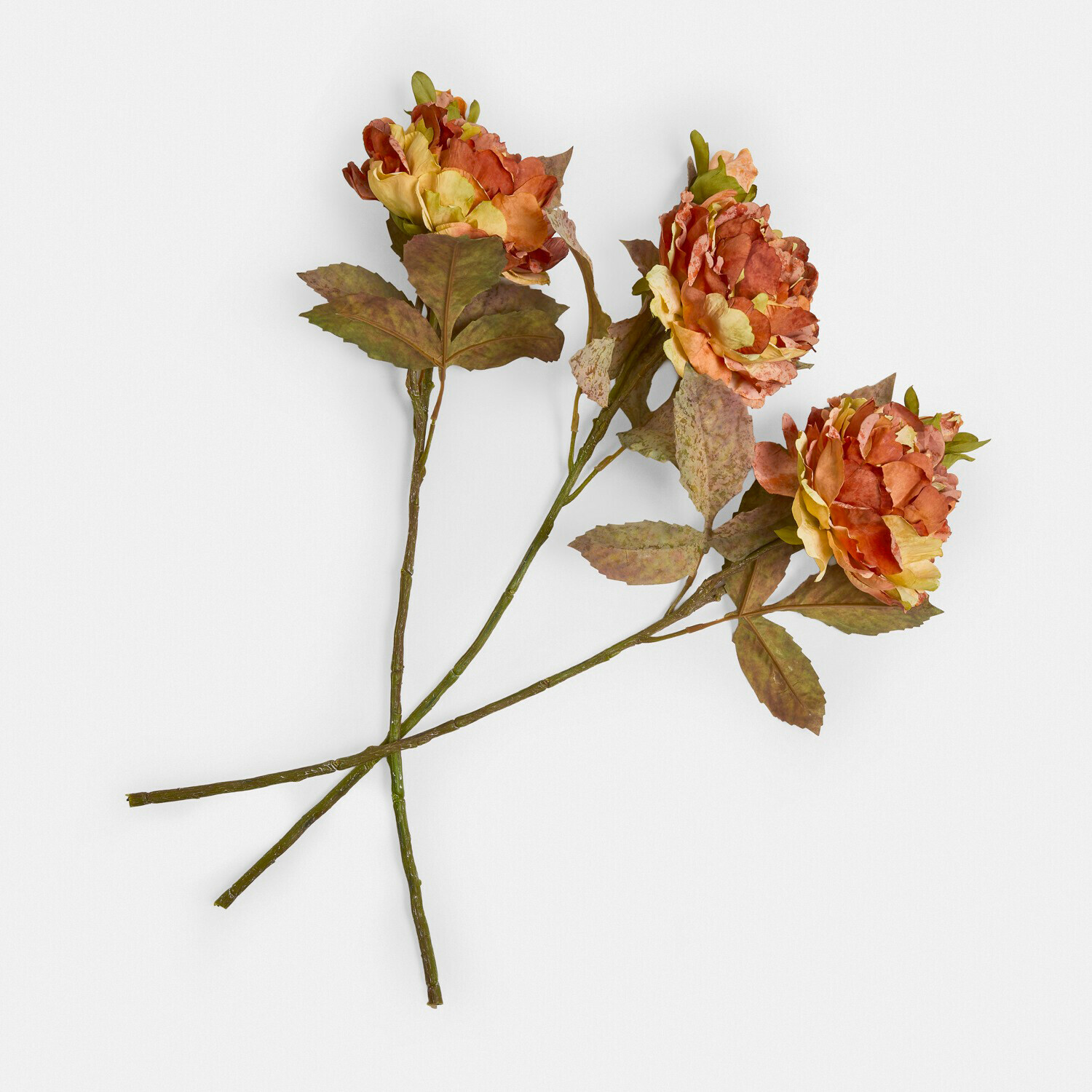 Kunstblume 3er Set Ambrayelle Drei künstliche Blumen in Orange- und Gelbtönen mit grünen Blättern auf weißem Hintergrund